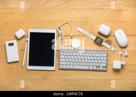 Composition with different modern gadgets on wooden background Stock Photo