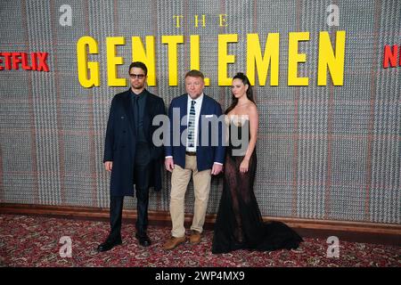 Theo James, Guy Ritchie and Kaya Scodelario attending the premiere of Netflix series The Gentlemen at the Theatre Royal Drury Lane, London. Picture date: Tuesday March 5, 2024. Stock Photo