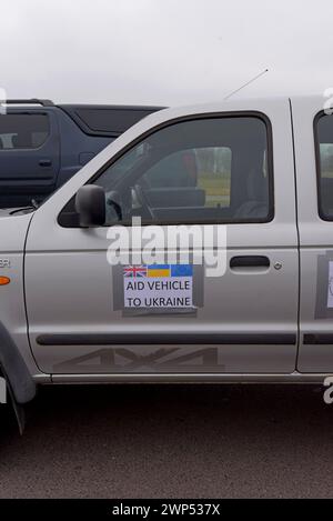 Stickers with Ukrainian flags on the door of 4x4 vehicle on an aid convoy to Ukraine with Pickups for Peace charity, March 2024 Stock Photo