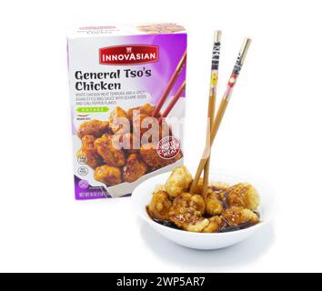 Ocala, Fl 3-5-2024 Innovasian general tsos chicken frozen cooked in bowl with chopsticks.  white chicken meat tempura and spicy asian style bbq sauce Stock Photo