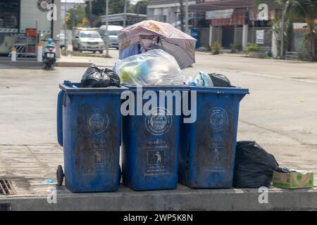 SAMUT PRAKAN, THAILAND, FEB 26 2024, Full garbage containers in the streets of the city Stock Photo