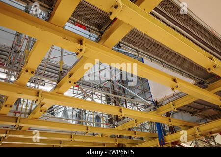 Curated visual reference: Visual Reference: Industrial Ceiling With Metal Beams And Electrical Conduits Stock Photo
