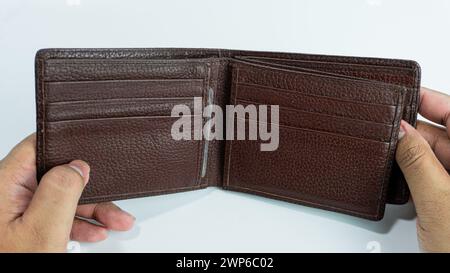 Wallet opened by hand isolated on white background Stock Photo