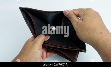 Empty wallet opened by hand isolated on white background Stock Photo