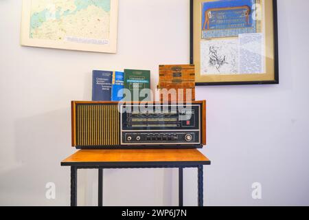 An old short wave, ham radio and books on display in a room at the base of one of the observatory buildings. At the astronomical observatory hilltop c Stock Photo