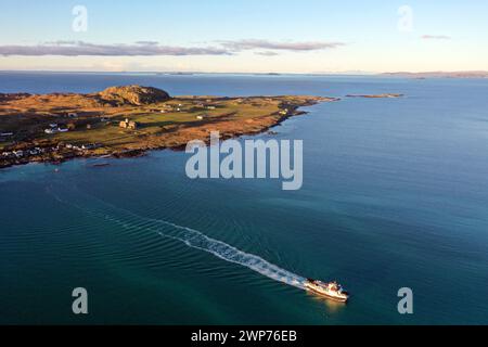 Calmac Ferry crossing the Sound of Iona having departed the Isle of Iona and heading for Fionnphort on the Isle of Mull Stock Photo