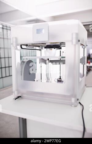 3d printer, lab and tech in creative, prototyping and design in digital robotics innovation. Printing, machine and electronics to process, robot and Stock Photo