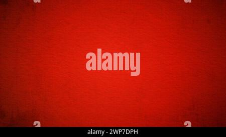 A sheet of bright red paper with light vignetting around the edges. Passionate red color. Saturated bright paint. Paper texture. Background for greeti Stock Photo