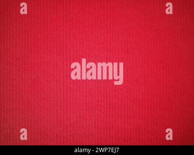 A sheet of bright red paper with barely noticeable vignetting around the edges. Passionate red saturated color. Paper texture. Background whether post Stock Photo