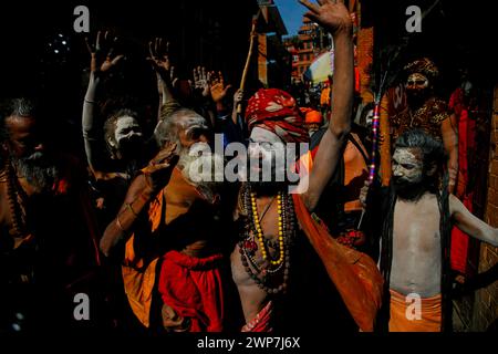 Kathmandu, Nepal. 06th Mar, 2024. A Sadhu follower of Lord Shiva carries another holy man while taking part in a religious rally for the upcoming Maha Shivaratri festival inside Pashupatinath Temple. Thousands of sadhus from India and Nepal come to celebrate the festival of Maha Shivaratri by smoking marijuana, smearing their bodies with ash, and offering prayers devoted to the Hindu Deity Lord Shiva. Credit: SOPA Images Limited/Alamy Live News Stock Photo