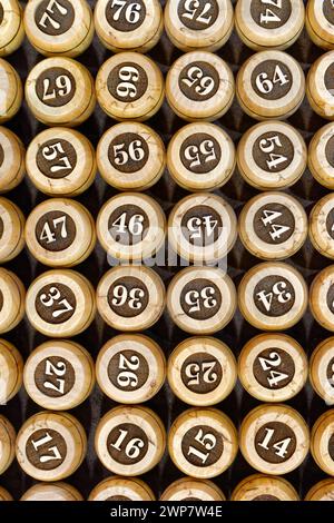 Big group of wooden lotto barrels with numbers, abstract random numbers background Stock Photo