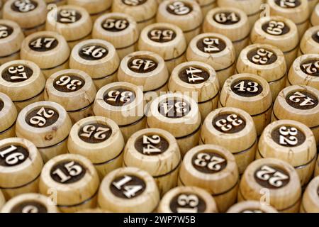 Big group of wooden lotto barrels with numbers, abstract random numbers background Stock Photo