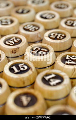 Big group of wooden lotto barrels with numbers, abstract random numbers background Stock Photo