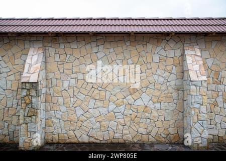 A fence made of decorative stone Stock Photo