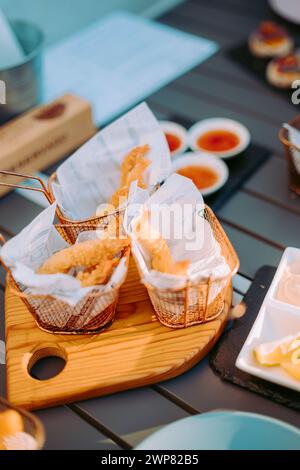 Delicious fried shrimps elegantly served with sauces on the restaurant table, Portugal Stock Photo