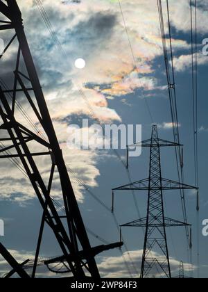 I love electricity pylons; I find their abstract, gaunt shapes endlessly fascinating. They are quite ubiquitous in farming areas of rural Oxfordshire, Stock Photo