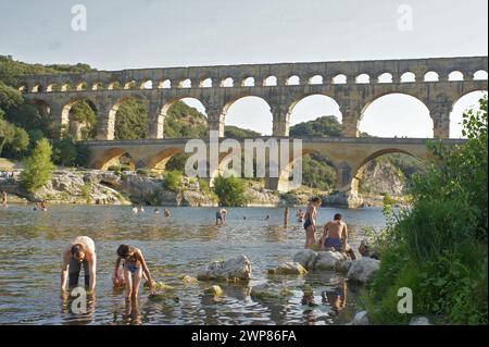 Scenic closeup on the Unesco and World heritage Roman architectural masterpiece, the three-tiered aqueduct Pont du Gard in France Stock Photo