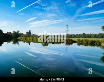 This beautiful and somewhat surreal scene of deep skies, vapour trails and reflections was filmed by the Thames at Kennington. It was first light on a Stock Photo