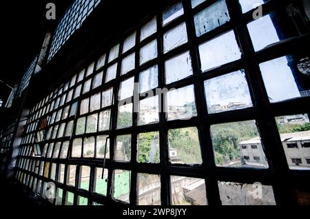 The cityscape seen through dirty window pane Stock Photo