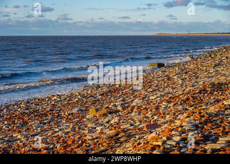 Brick and stone rubble from the Liverpool Blitz spread on the beach at Crosby, Merseyside. Stock Photo