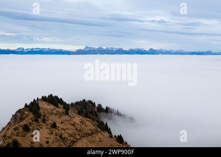 An aerial view of Mount Grappa in the sea of clouds. Italian alps Stock Photo