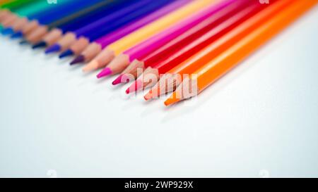Set of colored pencils on a white background That is arranged in a bar graph, Color pencils on white background, Close up, seamless colored pencils ro Stock Photo