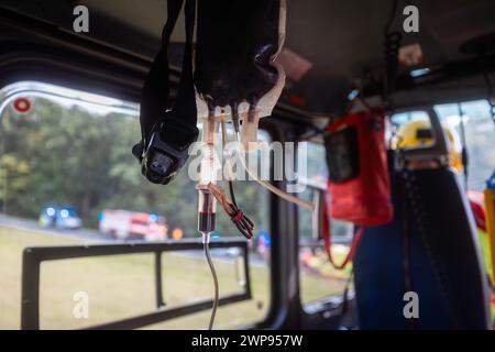 Transfusion bag with blood on board helicopter of air ambulance during flight. Themes emergency service, urgency medicine and rescue. Stock Photo