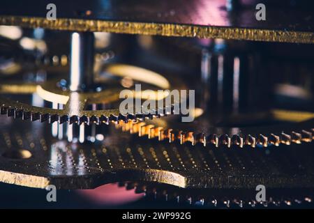 Macro view of gears in an old wall clock mechanism Stock Photo