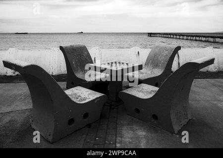 Seating outdoor chess on the sea front in Punta Arenas Stock Photo