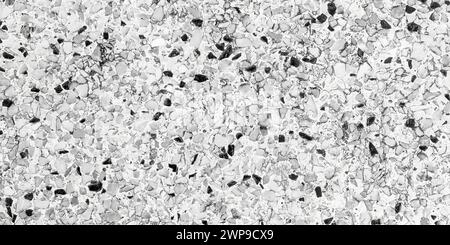 Stone mosaic floor in black and white color. Beautiful old polished stone wall for background Stock Photo