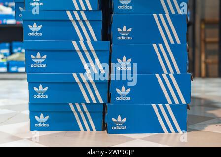 Adidas signature blue boxes on the floor on March 3, 2024, in Bangkok, Thailand. Stock Photo