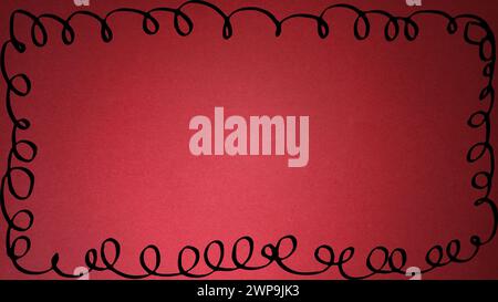 A sheet of bright red paper with vignetting around the edges. Passionate red. Saturated color. Paper texture. Black curly line around the edges. Stock Photo