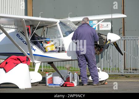 Light aircraft general aviation maintenance working on a Eurofox aircraft with a Rotax engine - March 2024 Stock Photo