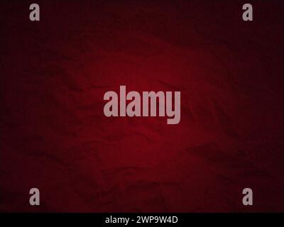 Dark red background with uneven spots and vignetting. Crumpled thick paper texture. Blood red color. Dark frame around the edges Stock Photo