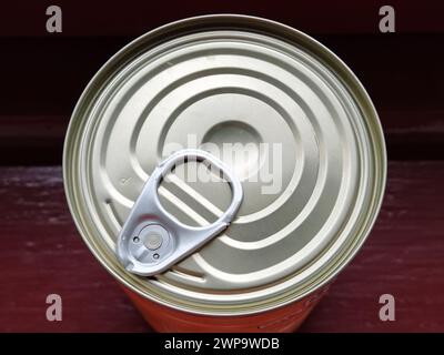 canned food lid with a bottle opener. Hook metal can top for easy opening Stock Photo