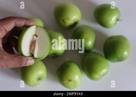 Ber apple or Juju Be. Vibrant image of Juju Be apple, showcasing its texture and rich color, both inside and outside. Perfect for health, nutrition, a Stock Photo