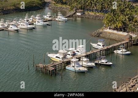 Puerto Quetzal, Guatemala - 19 January 2024: Aerial view of fishing boats in the harbour of the city's coastal port Stock Photo