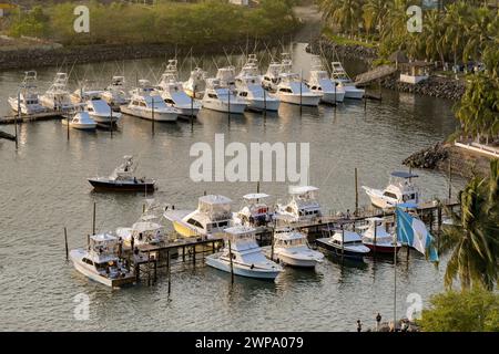 Puerto Quetzal, Guatemala - 19 January 2024: Aerial view of fishing boats in the harbour of the city's coastal port Stock Photo