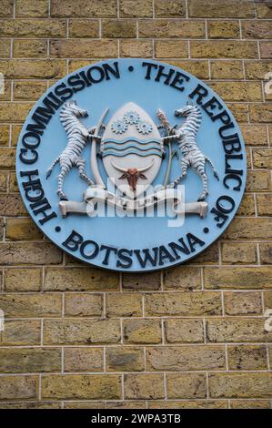 Plaque bearing the national coat of arms of Botswana displayed on the facade of the High Commission of Botswana on Stratford Place London England UK Stock Photo
