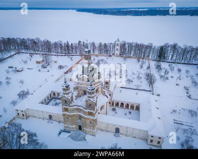 Aerial view of Baroque architecture Pazaislis monastery in Kaunas, Lithuania in winter with an icy Kaunas lagoon in background Stock Photo