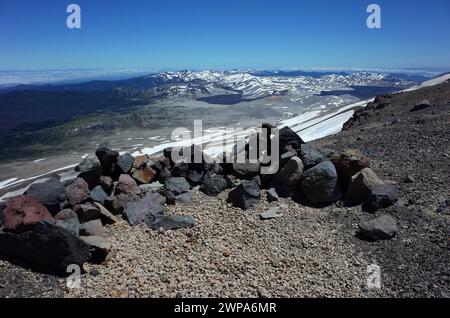 Stone wall wind shelter on summit of volcano Puyehue, Puyehue National Park, Chile. Andes, Nature of Patagonia Stock Photo