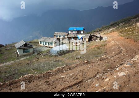 Old guest house is semi abandoned after earthquake in Nepal Himalayas, Before Lamjura La pass on trail between Jiri and Lukla - lower part of Everest Stock Photo