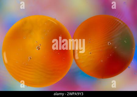 Colorful abstract macro background with oil drops in water Stock Photo