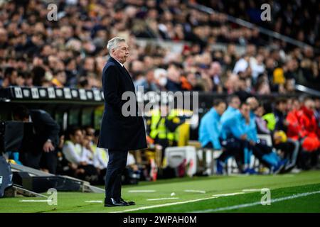 Real Madrid's Italian coach Carlo Ancelotti standing outside the bench during the match against Valencia Club de Futbol at Mestalla, Valencia, Spain. Stock Photo