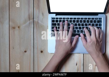 Close-up hands man who typing keyboard on computer laptop portable, top-view and copy space Stock Photo
