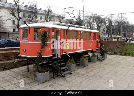 A vintage tram converted into a book and coffee  shop in the city centre of Lviv, Ukraine, March 2024 Stock Photo