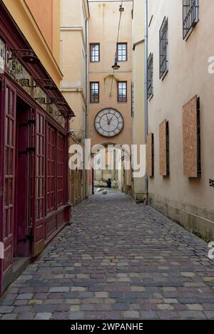 Windows in a narrow alley boarded up against missile attack, city of Lviv, Ukraine, March 2024 Stock Photo
