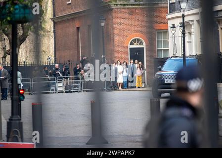 London, UK. 06th Mar, 2024. Family members and photographers wait for the Chancellor of the Exchequer, Jeremy Hunt and his colleagues front of the Prime Minister Office on the Downing Street. Budget day has fallen this year on the 6th of March. Budget day is when the Chancellor of the Exchequer presents the Government's plan to the MP's in House of Commons for the economy including taxation and spending. Credit: SOPA Images Limited/Alamy Live News Stock Photo