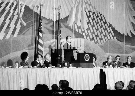 U.S. President Richard Nixon and U.S. First Lady Pat Nixon, both sitting left on dais, listening to Evangelist William F. 'Billy' Graham giving principal address at 17th Annual National Prayer Breakfast, Sheraton Park Hotel, Washington, D.C., USA, Marion S. Trikosko, U.S. News & World Report Magazine Photograph Collection, January 30, 1969 Stock Photo