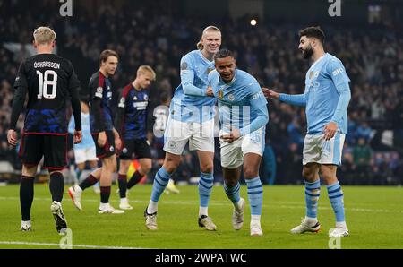 Manchester City's Manuel Akanji (centre) celebrates scoring their side's first goal of the game during the UEFA Champions League round of 16, second leg match at the Etihad Stadium, Manchester. Picture date: Wednesday March 6, 2024. Stock Photo